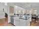Spacious kitchen with island, farmhouse sink, and hardwood floors at 1615 Paradise Lake Dr, Mount Pleasant, SC 29464