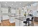 Modern kitchen with white cabinets, stainless steel appliances and large island at 1615 Paradise Lake Dr, Mount Pleasant, SC 29464