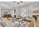 Spacious living room with hardwood floors and views into the dining room and entryway at 1615 Paradise Lake Dr, Mount Pleasant, SC 29464