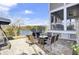 Enjoy outdoor dining on this spacious patio overlooking a peaceful lake at 1615 Paradise Lake Dr, Mount Pleasant, SC 29464