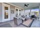 Spacious covered porch with wicker furniture and lake views at 1615 Paradise Lake Dr, Mount Pleasant, SC 29464