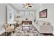 Light-filled sitting room featuring hardwood floors, comfortable seating, and a coffee table at 1615 Paradise Lake Dr, Mount Pleasant, SC 29464