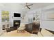 Bright living room with fireplace, hardwood floors, and comfy seating at 1729 Alan Brooke Dr, Mount Pleasant, SC 29466