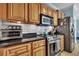 Kitchen with stove, microwave and granite countertop at 1984 Folly Rd # B214, Charleston, SC 29412