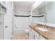 Bathroom with granite countertop, white cabinets, and a bathtub at 2333 Chatelain Way, Mount Pleasant, SC 29464