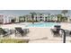 Inviting community pool with lounge chairs and surrounding apartments at 2333 Chatelain Way, Mount Pleasant, SC 29464