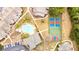 An aerial view shows the property's community pool and tennis courts, as well as parking and several residence buildings at 265 Alexandra Dr # 10, Mount Pleasant, SC 29464