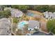 Aerial view of community pool, tennis courts, and building at 265 Alexandra Dr # 10, Mount Pleasant, SC 29464