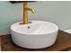 Modern bathroom vanity with a vessel sink and gold faucet at 265 Alexandra Dr # 10, Mount Pleasant, SC 29464
