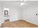 Simple bedroom with wood floors and ensuite bathroom at 265 Alexandra Dr # 10, Mount Pleasant, SC 29464