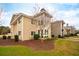 Tan two story home with modern design and landscaping at 265 Alexandra Dr # 10, Mount Pleasant, SC 29464