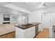 Modern kitchen island with a farmhouse sink and white cabinets at 265 Alexandra Dr # 10, Mount Pleasant, SC 29464