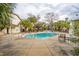 Community pool with surrounding lounge chairs and patio tables at 265 Alexandra Dr # 10, Mount Pleasant, SC 29464
