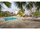 Community pool with lounge chairs and surrounding palm trees at 265 Alexandra Dr # 10, Mount Pleasant, SC 29464