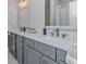 Double vanity bathroom with grey cabinets and quartz countertops at 270 Darby Meadow Ln, Ridgeville, SC 29472