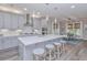 Modern kitchen with gray cabinets, white quartz countertops, and breakfast bar at 270 Darby Meadow Ln, Ridgeville, SC 29472