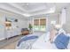 Main bedroom features a king-size bed, dresser, and seating area at 270 Darby Meadow Ln, Ridgeville, SC 29472