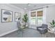 Home office with glass desk, comfortable seating, and natural light at 270 Darby Meadow Ln, Ridgeville, SC 29472