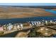 Aerial view of waterfront homes and marsh at 279 Driftwood Ln, Edisto Beach, SC 29438