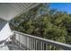 Private balcony overlooking lush trees and landscape at 279 Driftwood Ln, Edisto Beach, SC 29438