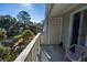 Balcony with wooded views and access to a door at 279 Driftwood Ln, Edisto Beach, SC 29438