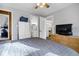 Main bedroom with a dresser and views of the bathroom and kitchen at 279 Driftwood Ln, Edisto Beach, SC 29438