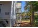 Exterior view of a three-story home with stairs and deck at 279 Driftwood Ln, Edisto Beach, SC 29438