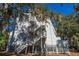 Exterior of a three-story home with multiple staircases at 279 Driftwood Ln, Edisto Beach, SC 29438