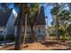 A-frame home with gray siding and private balcony at 279 Driftwood Ln, Edisto Beach, SC 29438