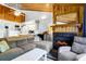 Living room with fireplace and kitchen area at 279 Driftwood Ln, Edisto Beach, SC 29438