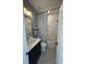 Clean bathroom with a navy vanity, hex tile floors, and a shower/tub combo at 304 Trailmore Ln, Summerville, SC 29486
