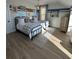 Beach-themed bedroom with twin beds, light wood floors, and surf decor at 304 Trailmore Ln, Summerville, SC 29486