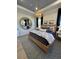 Bedroom with wood bed frame, blue bedding, and round mirror at 304 Trailmore Ln, Summerville, SC 29486