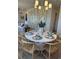 Elegant dining room featuring a round table and statement chandelier at 304 Trailmore Ln, Summerville, SC 29486