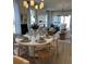 Open concept dining area with hardwood floors and large windows at 304 Trailmore Ln, Summerville, SC 29486