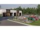 Charleston Toy Box: Modern garage units and landscaped area with parked cars at 3100 Fickling Hill Rd # 78, Johns Island, SC 29455