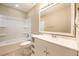 Clean bathroom featuring a shower/tub combo, white vanity, and a framed mirror at 407 Kingbird Road, Ladson, SC 29456