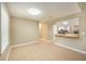 Simple dining area with tile floors and a view into the kitchen at 407 Kingbird Road, Ladson, SC 29456