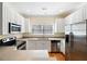 Bright kitchen with stainless steel appliances and white cabinets at 4156 Perrine St, Charleston, SC 29414