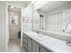 Bathroom with a gray vanity, white countertop, and a large mirror at 534 Farmers Market Rd, Saint George, SC 29477