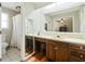 Bathroom with double vanity, large mirror, and shower at 534 Farmers Market Rd, Saint George, SC 29477