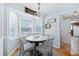 Bright dining area with a round table and four chairs, featuring a bay window at 534 Farmers Market Rd, Saint George, SC 29477