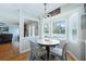 Charming farmhouse-style dining area with a round table and four chairs, overlooking a backyard at 534 Farmers Market Rd, Saint George, SC 29477