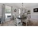 Bright dining room with gray walls and a rustic chandelier at 534 Farmers Market Rd, Saint George, SC 29477