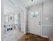 Bright entryway with stone flooring and view to dining area at 534 Farmers Market Rd, Saint George, SC 29477