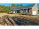 Brick ranch home with covered porch and landscaping at 534 Farmers Market Rd, Saint George, SC 29477