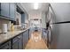Modern kitchen with granite countertops and stainless steel appliances at 534 Farmers Market Rd, Saint George, SC 29477
