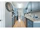 Galley kitchen with granite countertops and blue cabinets at 534 Farmers Market Rd, Saint George, SC 29477
