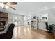 Bright living room with hardwood floors, fireplace, and access to backyard at 534 Farmers Market Rd, Saint George, SC 29477