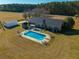 Inviting in-ground pool with ample deck space and surrounding yard at 534 Farmers Market Rd, Saint George, SC 29477